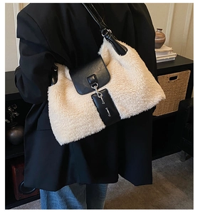 Detail showing plush faux fur texture and black leather flap of the stylish shoulder bag