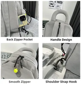 Detail view of light grey backpack with back anti-theft pocket and tennis ball charm