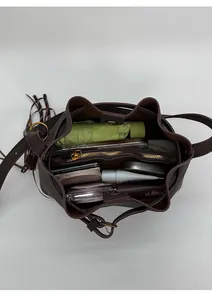 Top view of deep brown bucket bag interior showing large capacity for daily essentials