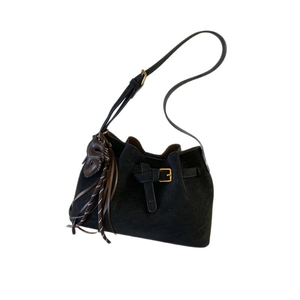 Vintage black suede hobo bag with fringe tassel and golden hardware in retro style