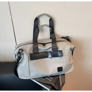 Close-up of a large grey travel bag with durable nylon fabric and Weilabag logo