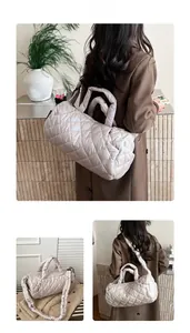 Detailed quilted champagne puffer tote bag with diamond stitching and thick strap