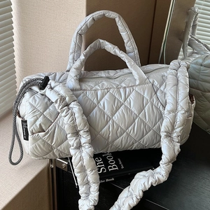 Grey quilted down cotton tote bag with stylish ruched shoulder strap and cylinder shape