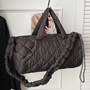 Quilted chocolate brown tote bag with large capacity and ruffled strap for winter styling