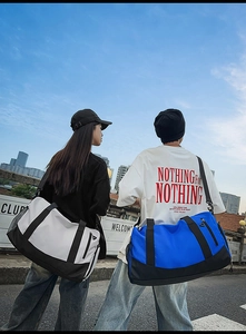 Detail of multi-functional travel bag with shoe compartment and waterproof zippers