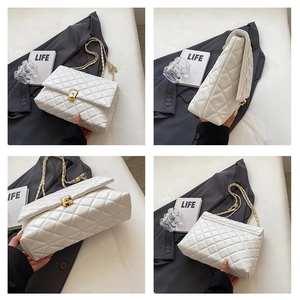 Detailed views of white quilted crossbody bag with gold chain and diamond pattern
