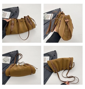 Detailed views of vintage pleated camel tote bag with drawstring and silver metal buckles