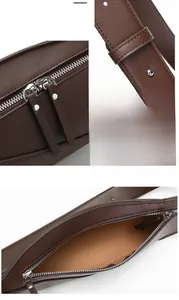 Detail of dark brown leather crossbody bag with silver double zippers and wide strap