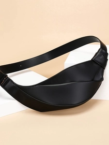 Minimalist black crescent crossbody bag with side knot detail and wide shoulder strap