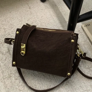 Chic dark brown faux suede underarm bag with gold hardware and double zippers