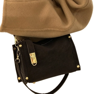 Deep brown matte suede underarm bag with gold metal buckle and vintage square design