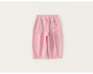 Close-up of pink cotton trousers featuring elastic waist and cute heart pocket embroidery