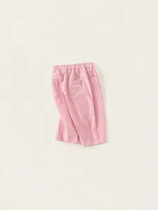 Pink cotton casual trousers for girls with elastic waist and cute heart pocket patch