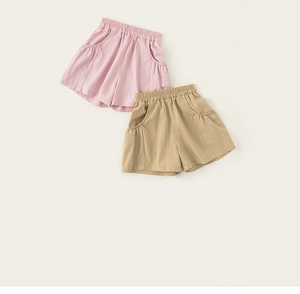 Close-up of pink and khaki kids cargo shorts featuring elastic waist and side pockets