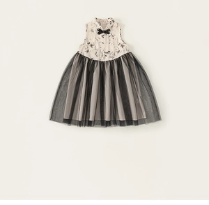 Detail view of girls sleeveless dress with ink floral print and black mesh skirt