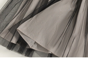 Detail of multi-layered mesh tutu skirt with black tulle and light grey inner lining