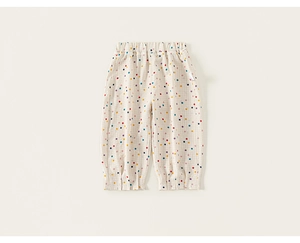 Détail du pantalon à pois pour bébé fille en coton respirant avec taille élastique