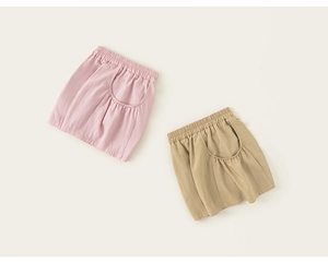 Close-up of lightweight cotton linen kids shorts with elastic waist and cargo pockets