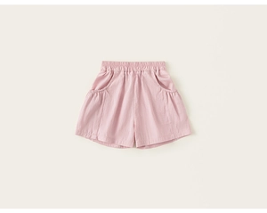Detail of pink girls cotton shorts featuring elastic waist and functional side pockets
