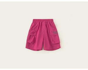 Detail of rose pink cargo shorts showing elastic waistband and large side pockets