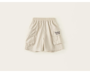 Detail view of beige kids cargo shorts with elastic waist and large side pockets