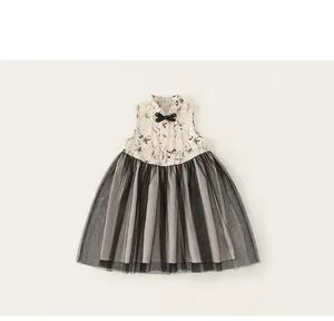 Detail of girls' Chinese style dress with ink flower print and black tutu tulle skirt