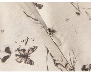 Macro detail of high-quality invisible zipper on traditional ink print girls' dress