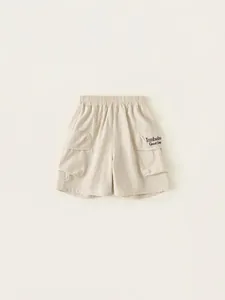 Kids minimalist cargo shorts in beige with elastic waist and large side pockets