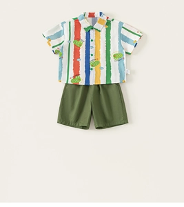 Close-up of boys summer set featuring colorful striped crocodile shirt and green shorts