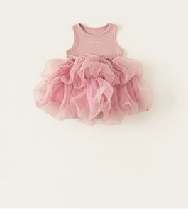 Detail view of pink sleeveless girl princess dress with layered fluffy tulle mesh skirt