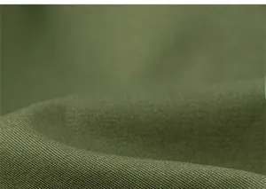 Close-up macro shot of dark olive green woven fabric showing textile texture and quality