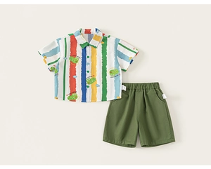 Detail of boys' short-sleeved striped shirt with cartoon crocodile print and olive shorts