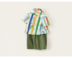 Detail view of boys' summer set with colorful striped crocodile shirt and olive shorts