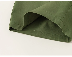 Close-up of army green cotton twill fabric with precise single-needle stitching details