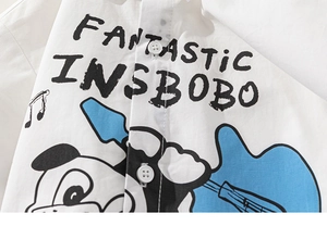 Close-up of white cotton shirt featuring a cartoon dog, guitar and Fantastic print