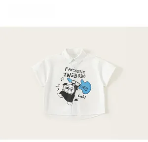 Close-up of white cotton short sleeve shirt featuring a cartoon dog playing guitar print