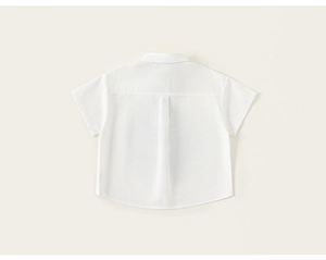 Rear view of white short sleeve shirt featuring a central box pleat and standard collar