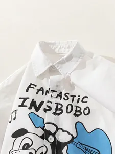Boys white lapel shirt featuring cool cartoon dog and guitar print on the chest