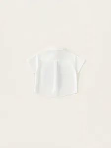Short sleeve white cotton shirt for boys featuring back pleat and turn-down collar