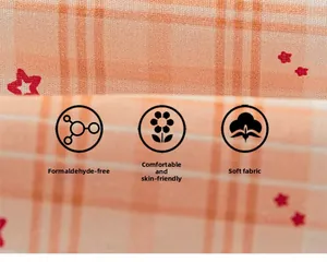 Close-up of soft orange plaid fabric with red star pattern, skin-friendly and breathable