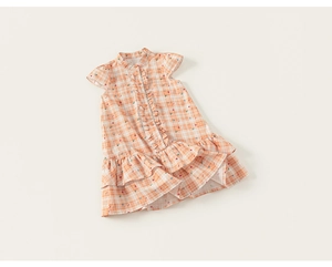 Detail view of girls' orange plaid dress with ruffles, small florals and buttoned placket