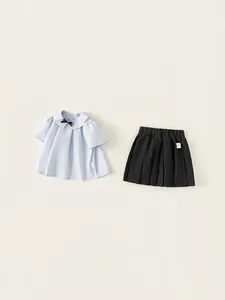 Ensemble d'été pour filles style preppy avec chemise en coton bleu clair et jupe plissée