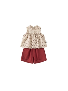 Girls summer floral sleeveless top and red shorts two-piece cotton set on white background