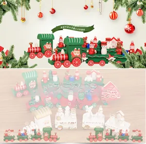 Detail of wooden Christmas train with miniature Santa Claus and snowman figures