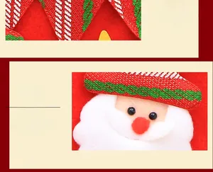 Close-up of 3D Santa Claus applique with fine stitching and soft red knit details