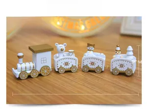 Detailed view of 21cm white and gold wooden Christmas train with festive figurines