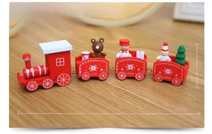 Detailed view of a 21cm red wooden Christmas train set with festive figurines on wood
