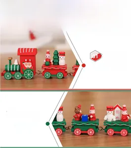 Detail of wooden Christmas train with painted snowman and Santa motifs on wood surface