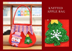 Close-up of a red knitted Christmas gift bag featuring a snowman and sequined tree
