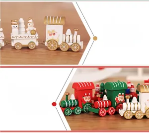 Detailed view of red, white and green Christmas wooden train with snowmen and trees